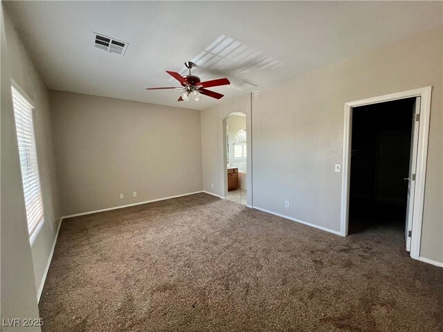 5524 Markley Ave, Las Vegas, NV 89141 - carpeted empty room featuring arched walkways, ceiling fan, and baseboards
