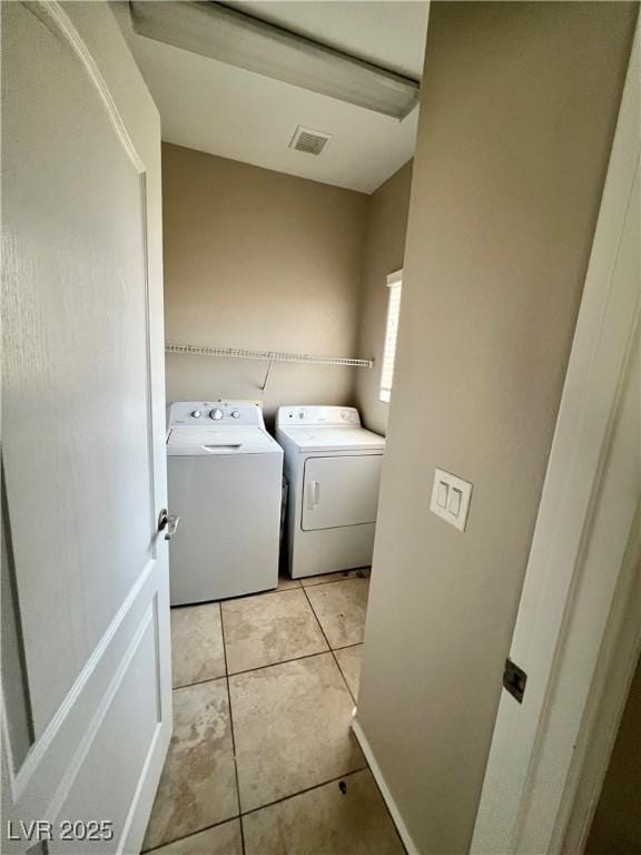 5524 Markley Ave, Las Vegas, NV 89141 - washroom featuring independent washer and dryer and light tile patterned floors