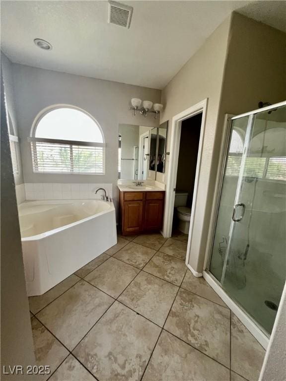 5524 Markley Ave, Las Vegas, NV 89141 - full bath featuring a bath, vanity, a shower stall, toilet, and tile patterned floors