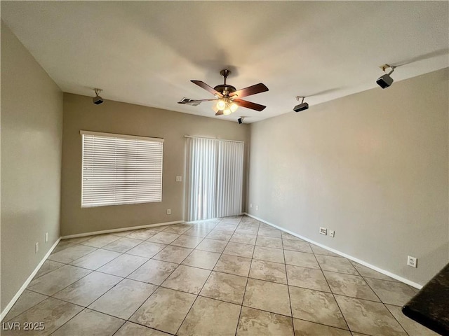 5524 Markley Ave, Las Vegas, NV 89141 - spare room with a ceiling fan, light tile patterned floors, and baseboards