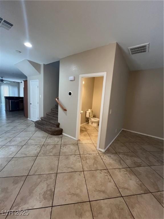 5524 Markley Ave, Las Vegas, NV 89141 - hall with stairs, light tile patterned flooring, and baseboards
