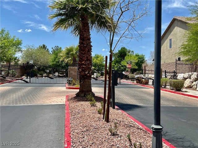 5524 Markley Ave, Las Vegas, NV 89141 - view of road featuring a gate, curbs, and a gated entry