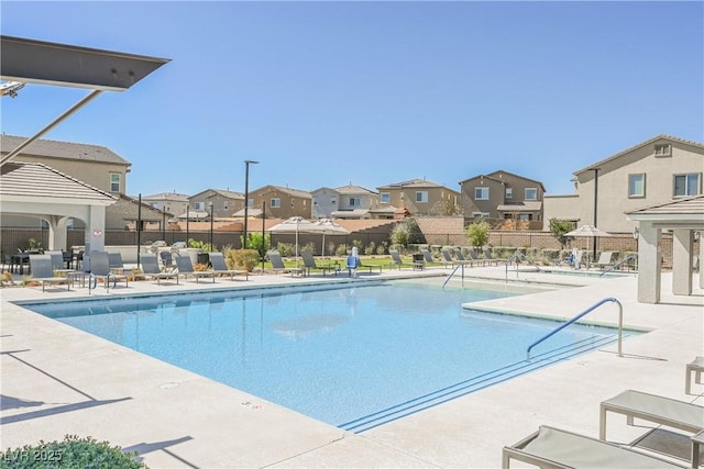 7002 Fossil Rim St, North Las Vegas, NV 89084 - community pool featuring a residential view and a patio area