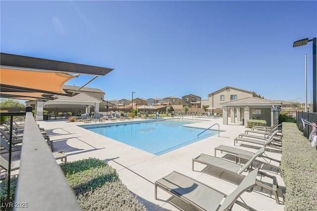 7002 Fossil Rim St, North Las Vegas, NV 89084 - community pool featuring a patio area and a residential view
