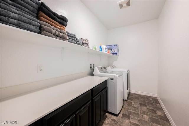 7002 Fossil Rim St, North Las Vegas, NV 89084 - washroom featuring washing machine and clothes dryer, cabinet space, baseboards, and stone finish flooring