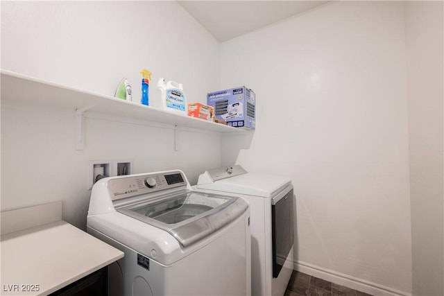 7002 Fossil Rim St, North Las Vegas, NV 89084 - washroom featuring washer and clothes dryer and baseboards