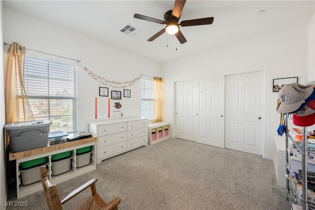 7002 Fossil Rim St, North Las Vegas, NV 89084 - carpeted bedroom with multiple windows, a closet, and a ceiling fan