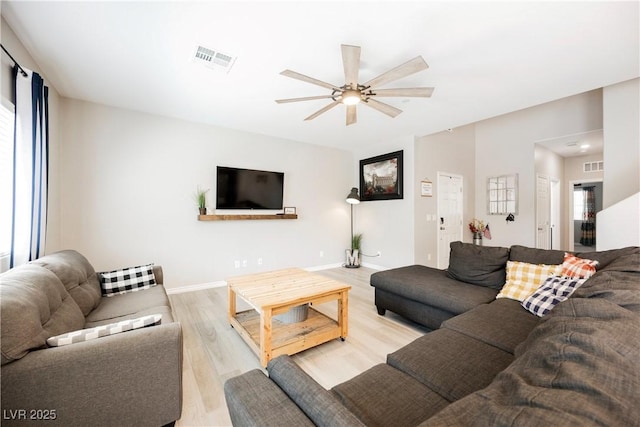 7002 Fossil Rim St, North Las Vegas, NV 89084 - living area featuring ceiling fan, light wood finished floors, and baseboards