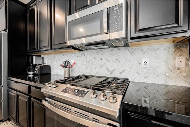7002 Fossil Rim St, North Las Vegas, NV 89084 - kitchen featuring stainless steel appliances, decorative backsplash, and dark countertops