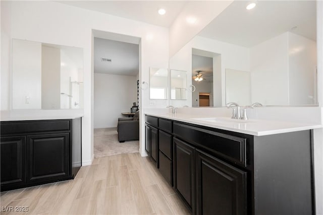 7002 Fossil Rim St, North Las Vegas, NV 89084 - bathroom featuring double vanity, a ceiling fan, and baseboards