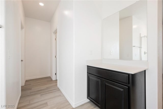 7002 Fossil Rim St, North Las Vegas, NV 89084 - hall with light wood finished floors, baseboards, and recessed lighting