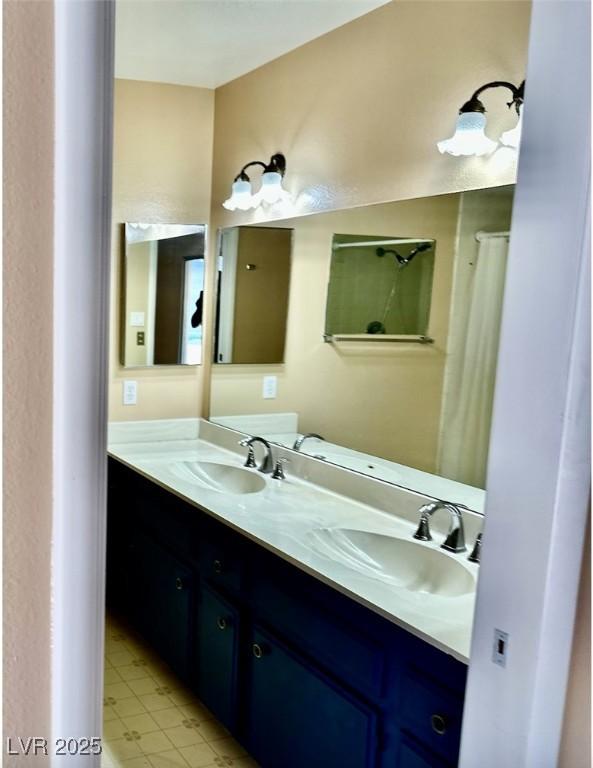 3729 La Junta Dr, Las Vegas, NV 89120 - bathroom with double vanity and tile patterned floors