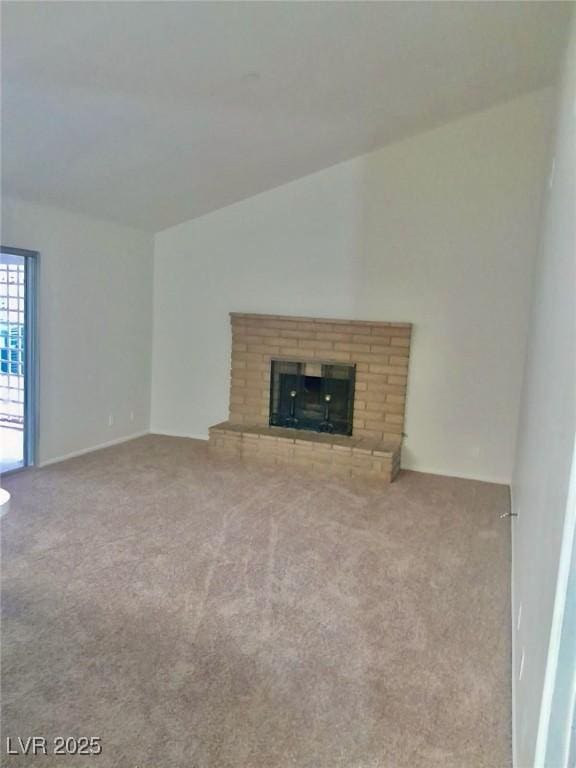3729 La Junta Dr, Las Vegas, NV 89120 - unfurnished living room with carpet flooring, vaulted ceiling, and a brick fireplace