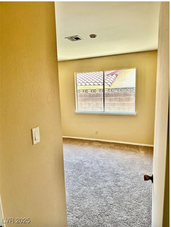3729 La Junta Dr, Las Vegas, NV 89120 - empty room with healthy amount of natural light, carpet flooring, and a textured wall