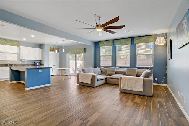 320 Point Loma Ave, North Las Vegas, NV 89031 - living room featuring a ceiling fan, dark wood finished floors, baseboards, and recessed lighting