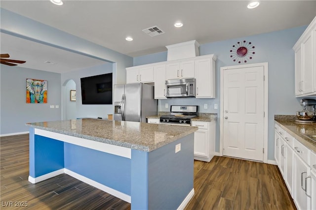 320 Point Loma Ave, North Las Vegas, NV 89031 - kitchen featuring appliances with stainless steel finishes, dark wood-style flooring, a kitchen island, baseboards, and recessed lighting