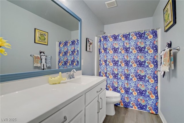 320 Point Loma Ave, North Las Vegas, NV 89031 - full bath with vanity, toilet, wood finished floors, and a shower with curtain