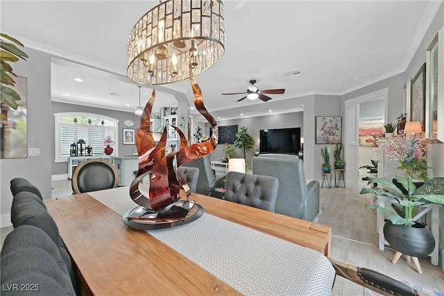 10484 Rose Park Ave, Las Vegas, NV 89135 - dining room featuring baseboards, ceiling fan, crown molding, wood finished floors, and recessed lighting