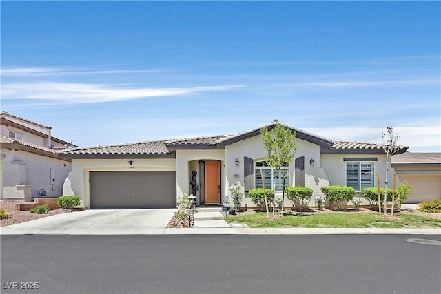 10484 Rose Park Ave, Las Vegas, NV 89135 - view of front facade featuring a garage, driveway, stucco siding, and a tiled roof