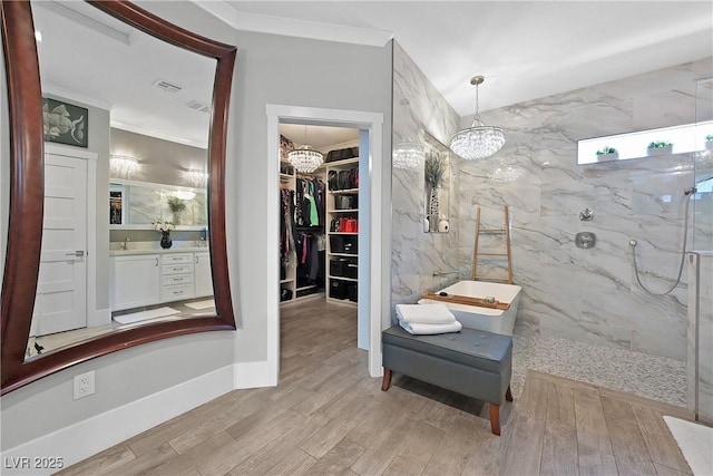 10484 Rose Park Ave, Las Vegas, NV 89135 - full bathroom with a chandelier, vanity, a marble finish shower, wood finished floors, and a spacious closet