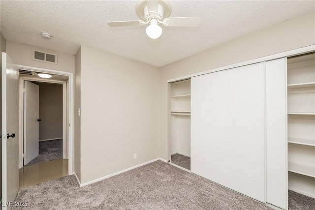 1509 Lucilee St, Las Vegas, NV 89101 - unfurnished bedroom with carpet, a closet, a textured ceiling, baseboards, and ceiling fan