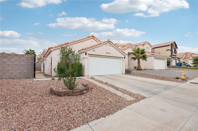 9333 Jumpin Juniper Ave, Las Vegas, NV 89129 - mediterranean / spanish house with driveway, stucco siding, a garage, and a tile roof