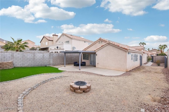 9333 Jumpin Juniper Ave, Las Vegas, NV 89129 - back of property with an outdoor fire pit, a patio, a fenced backyard, a residential view, and stucco siding