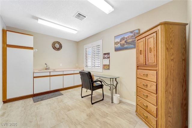 5829 W Patrick Ln, Las Vegas, NV 89118 - office area with a sink and baseboards
