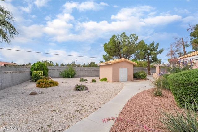 5829 W Patrick Ln, Las Vegas, NV 89118 - fenced backyard featuring an outbuilding