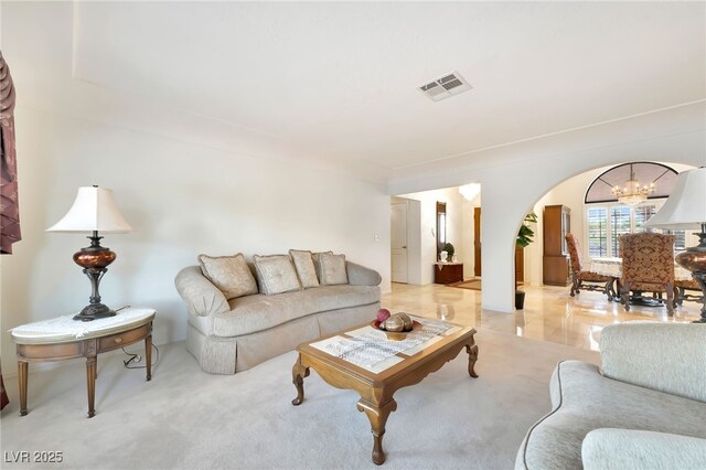 5829 W Patrick Ln, Las Vegas, NV 89118 - living area with arched walkways and a chandelier