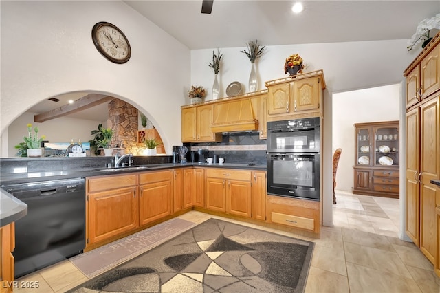 5829 W Patrick Ln, Las Vegas, NV 89118 - kitchen featuring black appliances, a sink, backsplash, dark countertops, and arched walkways