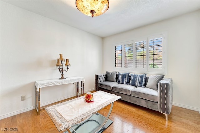 5829 W Patrick Ln, Las Vegas, NV 89118 - living room featuring light wood-style floors and baseboards