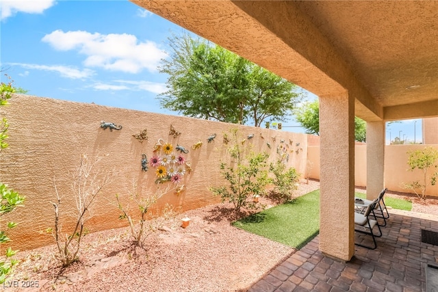 9704 Morgan Creek Ct, Las Vegas, NV 89141 - fenced backyard with a patio