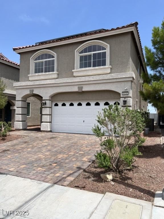 8116 Russell Creek Ct, Las Vegas, NV 89139 - traditional home with an attached garage, stucco siding, decorative driveway, and a tiled roof