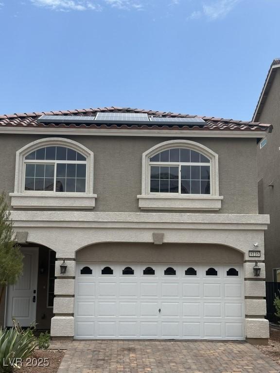 8116 Russell Creek Ct, Las Vegas, NV 89139 - view of front facade featuring a tile roof, decorative driveway, and an attached garage