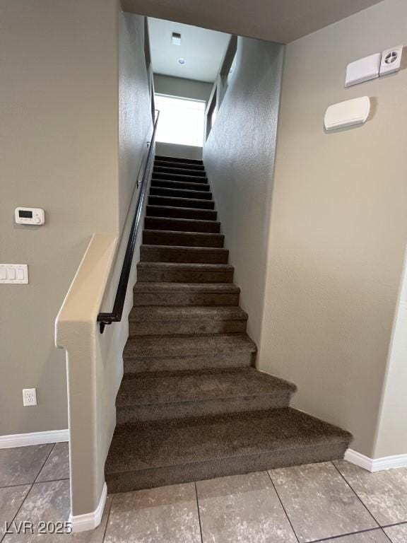 8116 Russell Creek Ct, Las Vegas, NV 89139 - staircase featuring baseboards and tile patterned floors