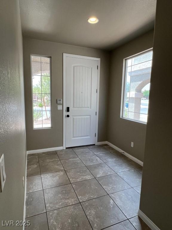 8116 Russell Creek Ct, Las Vegas, NV 89139 - tiled foyer with baseboards and recessed lighting