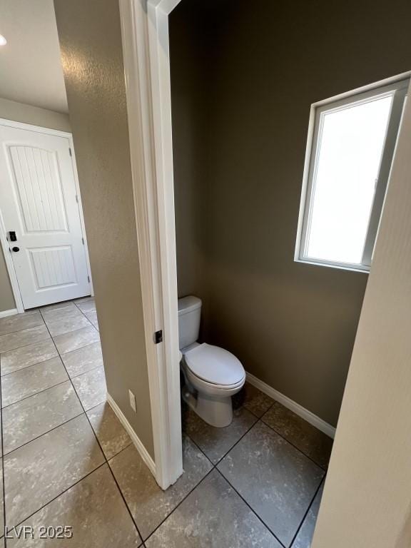 8116 Russell Creek Ct, Las Vegas, NV 89139 - bathroom with tile patterned floors, toilet, and baseboards