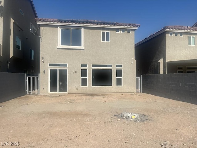 8116 Russell Creek Ct, Las Vegas, NV 89139 - back of property with stucco siding and a tiled roof