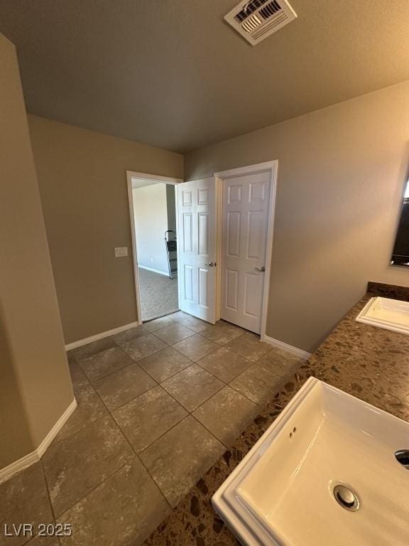 8116 Russell Creek Ct, Las Vegas, NV 89139 - bathroom with a sink and baseboards
