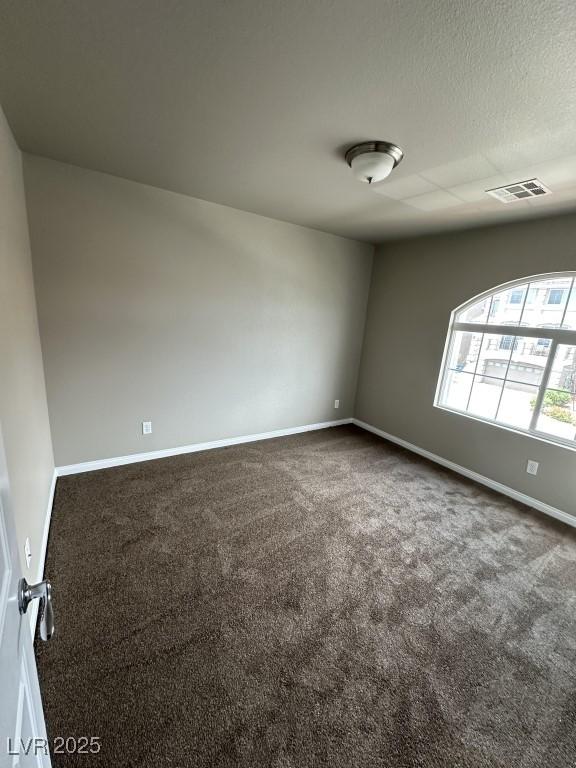 8116 Russell Creek Ct, Las Vegas, NV 89139 - empty room featuring carpet, baseboards, and a textured ceiling