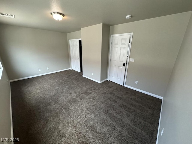 8116 Russell Creek Ct, Las Vegas, NV 89139 - unfurnished bedroom with baseboards, dark colored carpet, and a closet