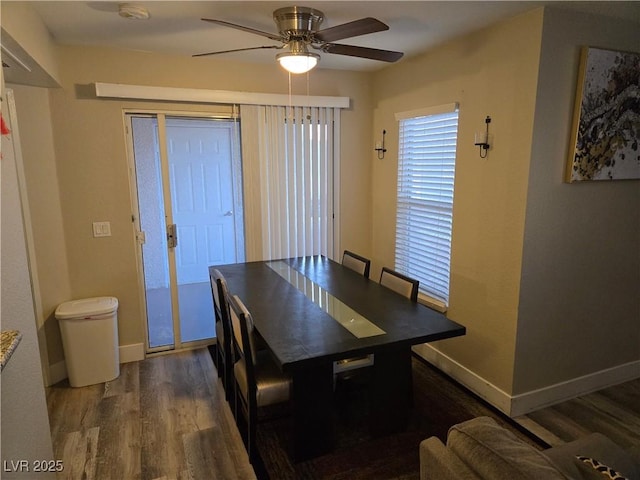 6800 E Lake Mead Blvd Unit 1126, Las Vegas, NV 89156 - dining room with wood finished floors, a ceiling fan, and baseboards