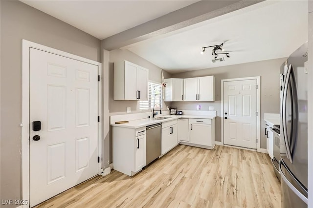 80 E Texas Ave, Henderson, NV 89015 - kitchen featuring a sink, stainless steel appliances, light wood-type flooring, and white cabinets