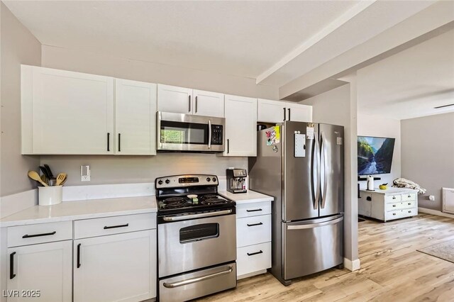 80 E Texas Ave, Henderson, NV 89015 - kitchen featuring stainless steel appliances, light wood-style floors, light countertops, and white cabinets