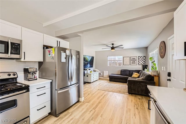 80 E Texas Ave, Henderson, NV 89015 - kitchen with stainless steel appliances, light countertops, white cabinets, and light wood-style flooring