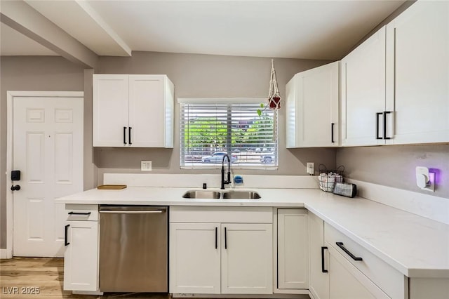 80 E Texas Ave, Henderson, NV 89015 - kitchen with stainless steel dishwasher, a sink, white cabinets, light wood-style floors, and light countertops