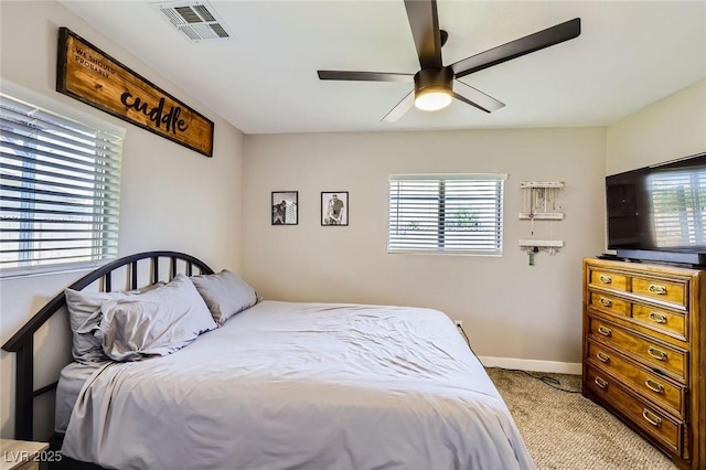 80 E Texas Ave, Henderson, NV 89015 - bedroom featuring multiple windows, carpet, baseboards, and a ceiling fan