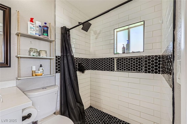 80 E Texas Ave, Henderson, NV 89015 - bathroom featuring a tile shower, toilet, and vanity