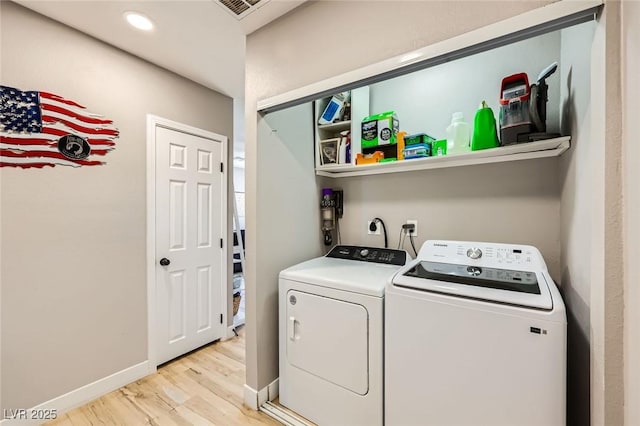80 E Texas Ave, Henderson, NV 89015 - laundry room featuring washing machine and clothes dryer, light wood-type flooring, and baseboards
